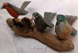 3 Hand Carved Canaries Perched On A Carved Wooden Log With 3 Nests Hand Painted