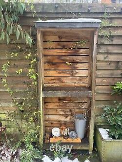 Bespoke Narrow Wooden Log Sore. Lead Roof And Feet