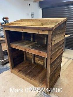 Rustic Wooden log store with kindling shelf