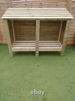 Wooden Log Store. Free delivery in the reading area