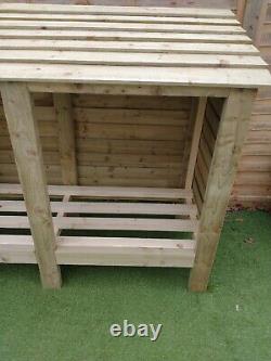 Wooden Log Store. Free delivery in the reading area
