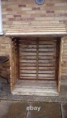 Wooden log store shed New