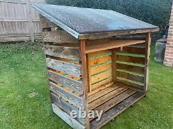 Wooden log store supplied with kiln dried hardwood 25cm logs